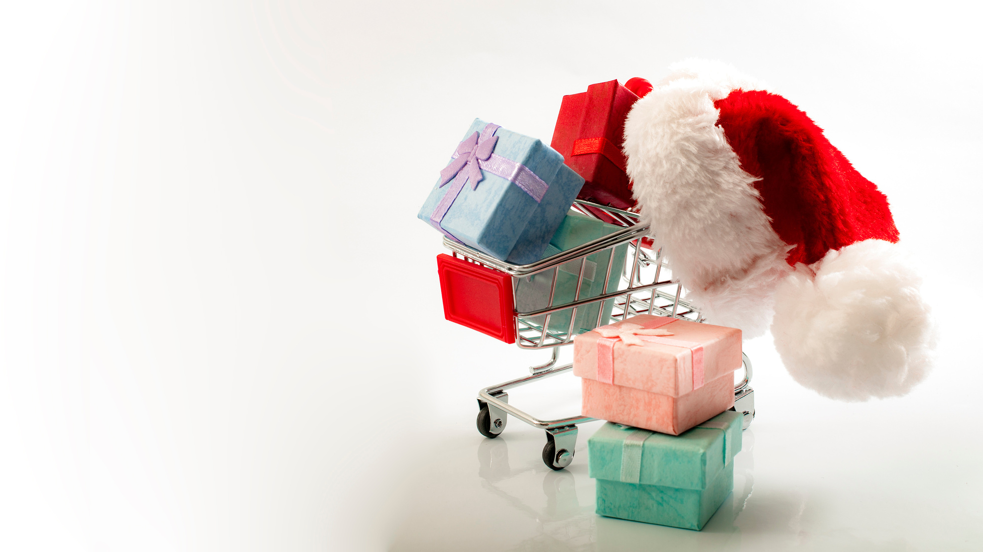 Holiday shopping and Christmas presents in a shopping cart