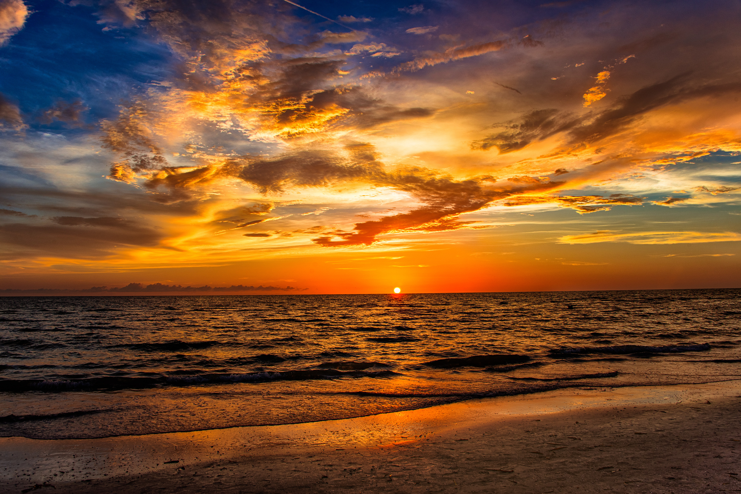 Landscape with beach and sea at sunset